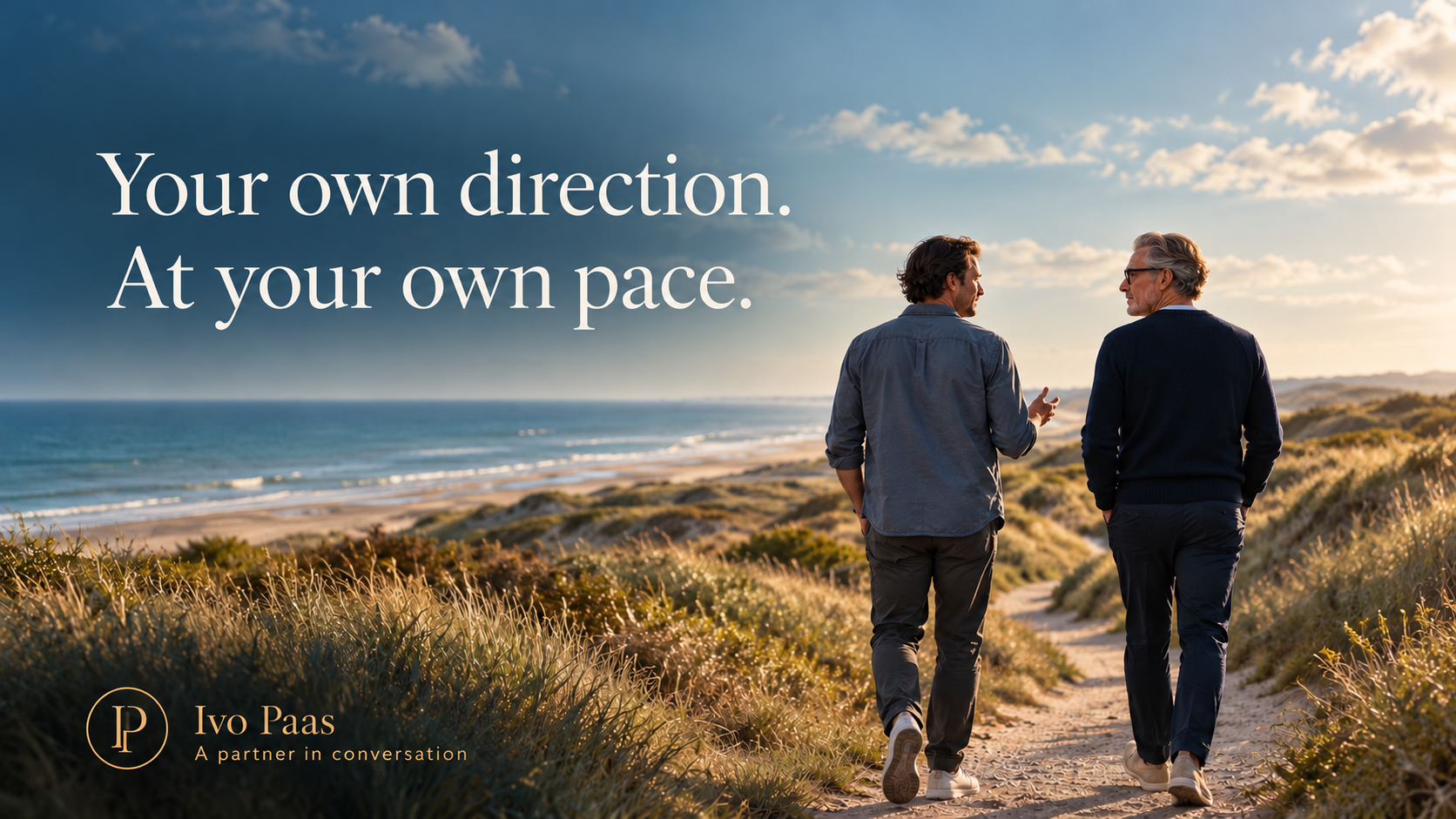 Your own direction. At your own pace. Ivo Paas walks beside a man on a quiet coastal dune path.